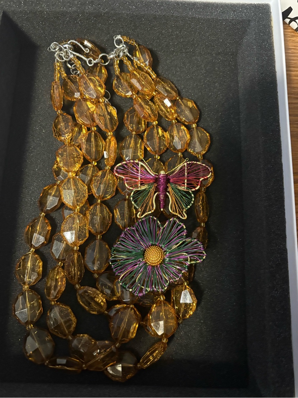 Sassy Jones Amber Bead Necklace with Multicolor Butterfly & Flower Charms